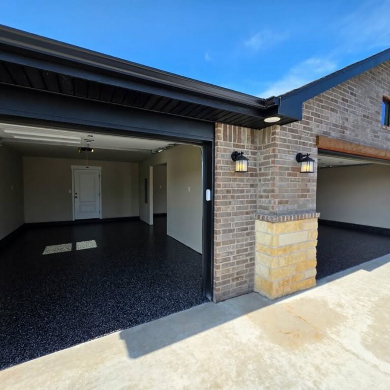 Black and white flake garage floor brick home Springfield MO — Ozarks Concrete Coatings