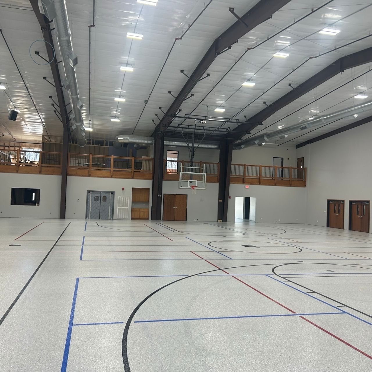 Church school gymnasium floor coating Springfield MO — Ozarks Concrete Coatings