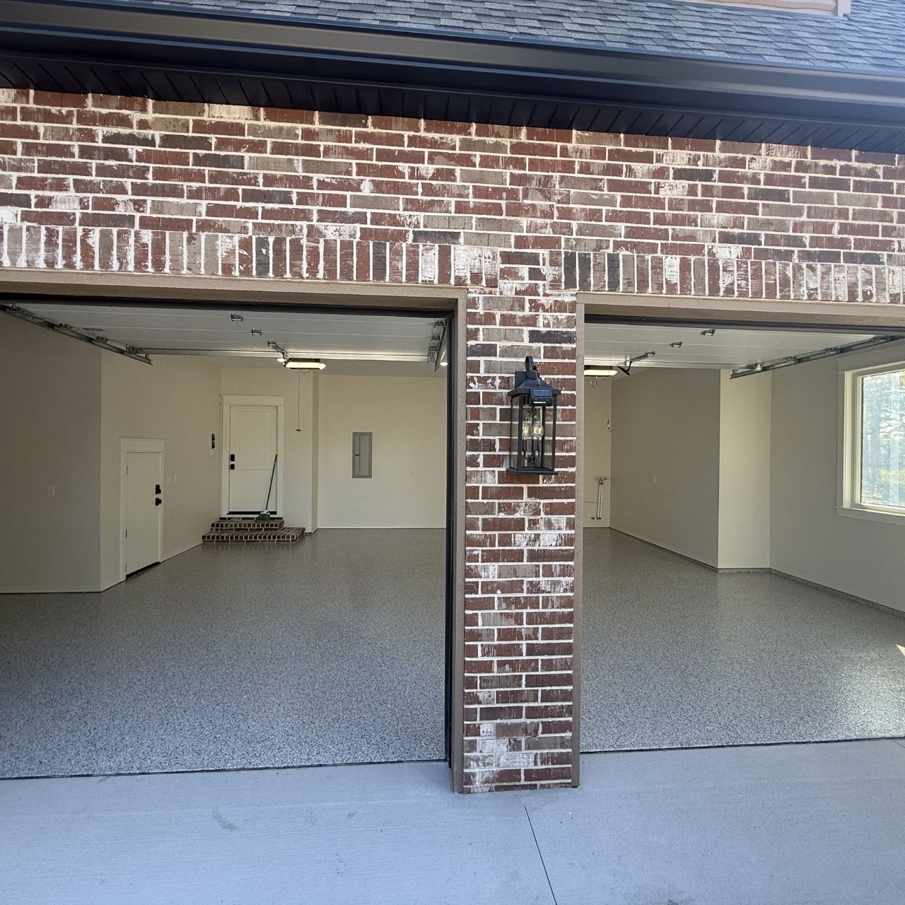 Three car garage epoxy floor coating brick home Springfield MO — Ozarks Concrete Coatings